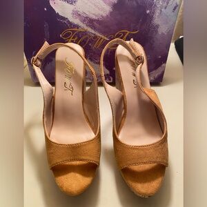 Never worn. Excellent condition and comes in original box